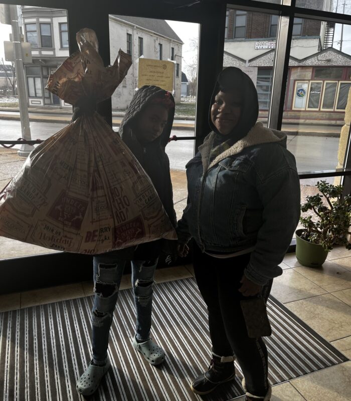 IMG_2144 image of child holding a box up