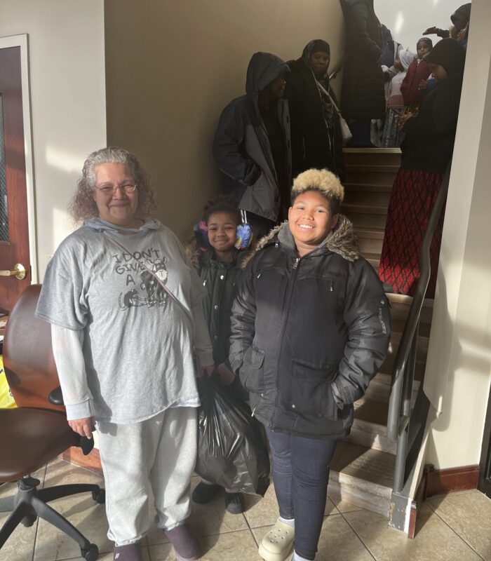 IMG_2145 image of people stadning before a stairwell