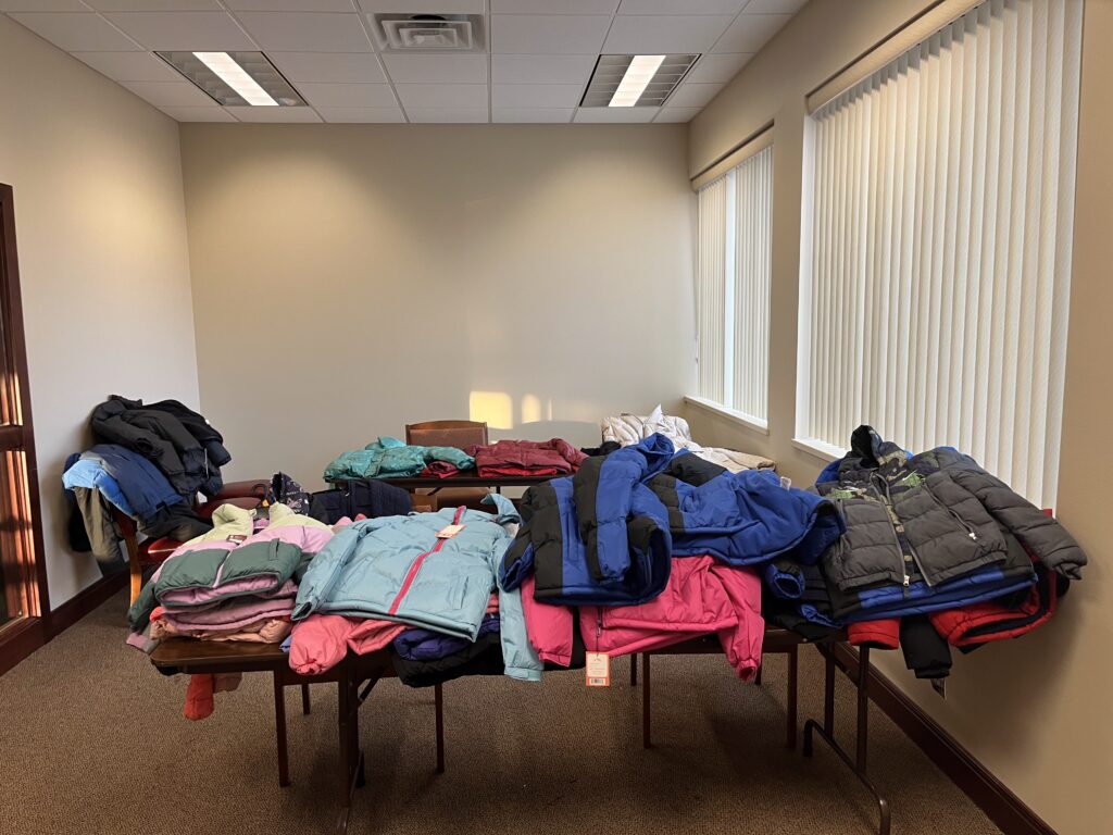 image of room with coats on a table