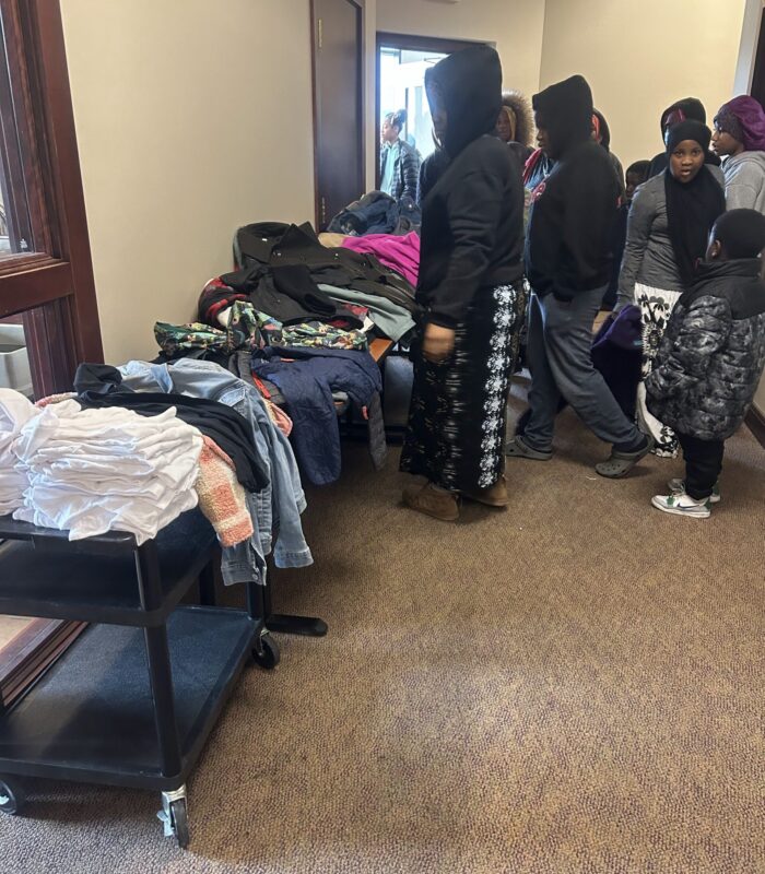 IMG_9270 image of room with people and coats on tables